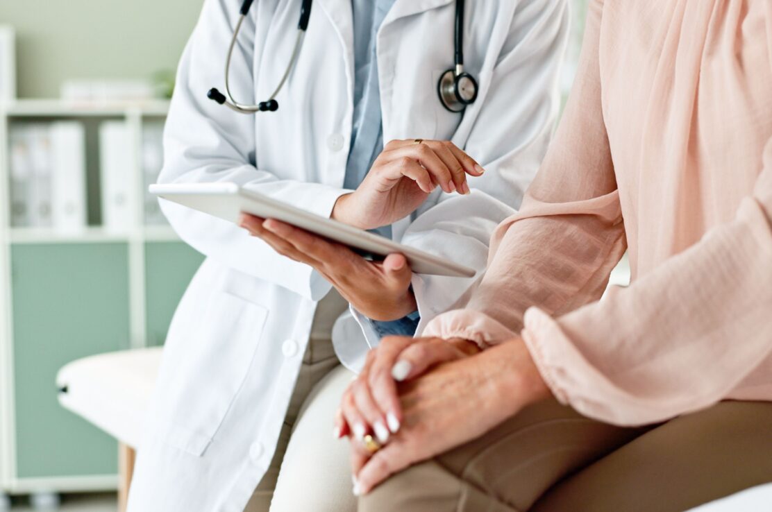 A doctor talking to a patient.