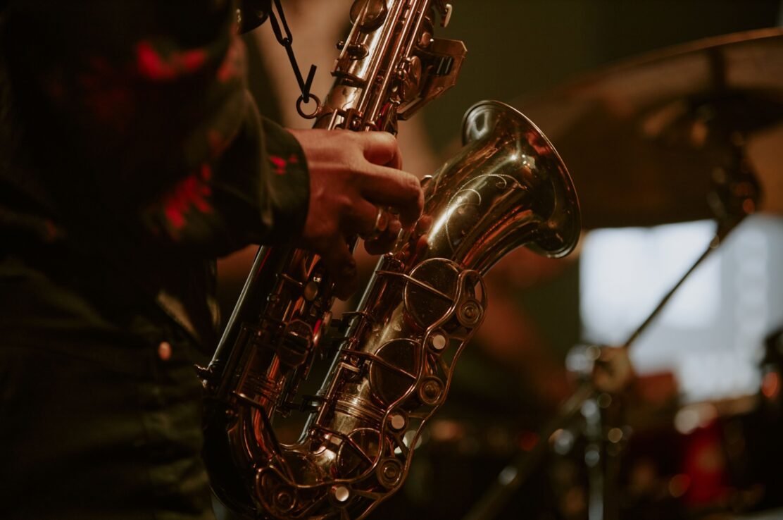 Someone playing a saxophone.