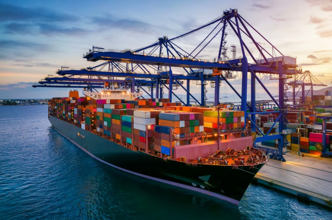 A container cargo ship at a commercial dock.
